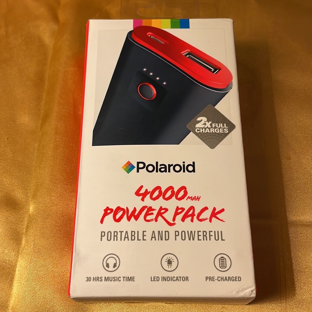 New with tags- Polaroid micro-USB (in) & USB (out), LED indicator, red & black